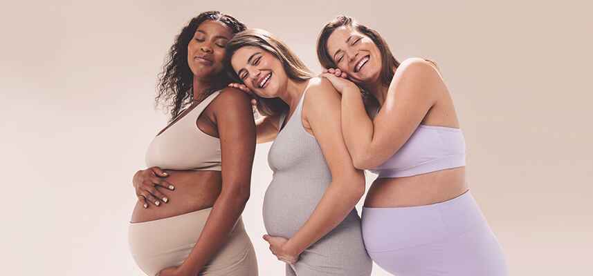 pregnant moms holding bellies